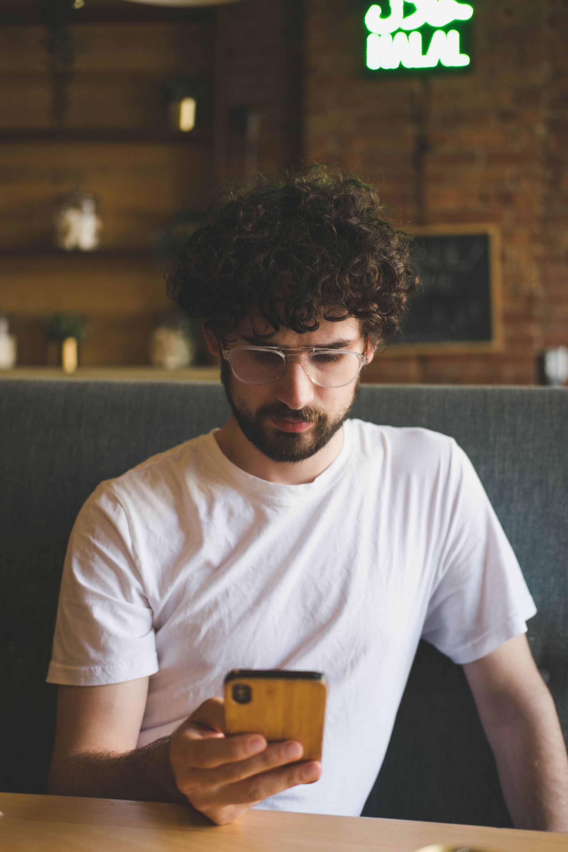 man with glasses on phone