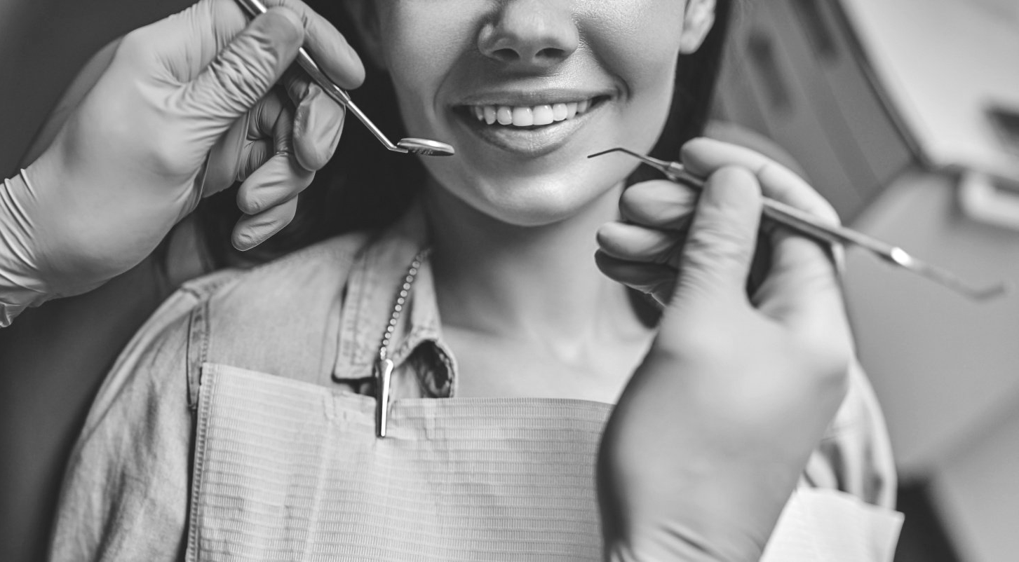 closeup of female patient mouth during dental exam