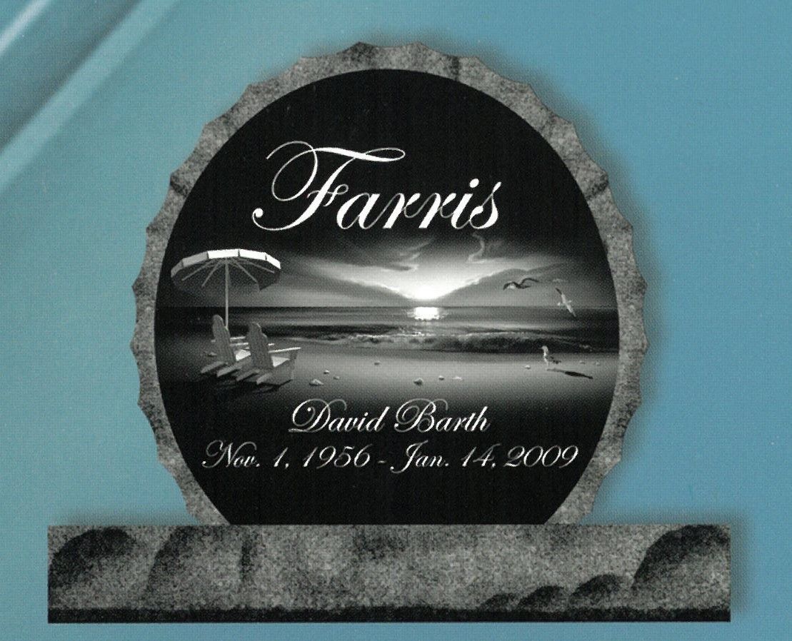 Black oval Farris memorial plaque with sunset scene and name/date inscription on a stone base