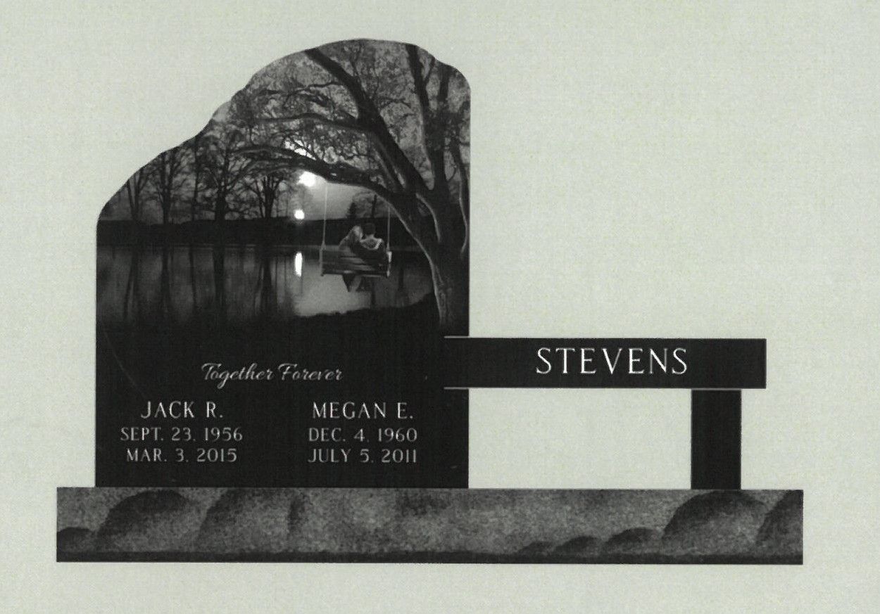 Black granite memorial headstone with tree engraving and the name STEVENS on a bench-style marker