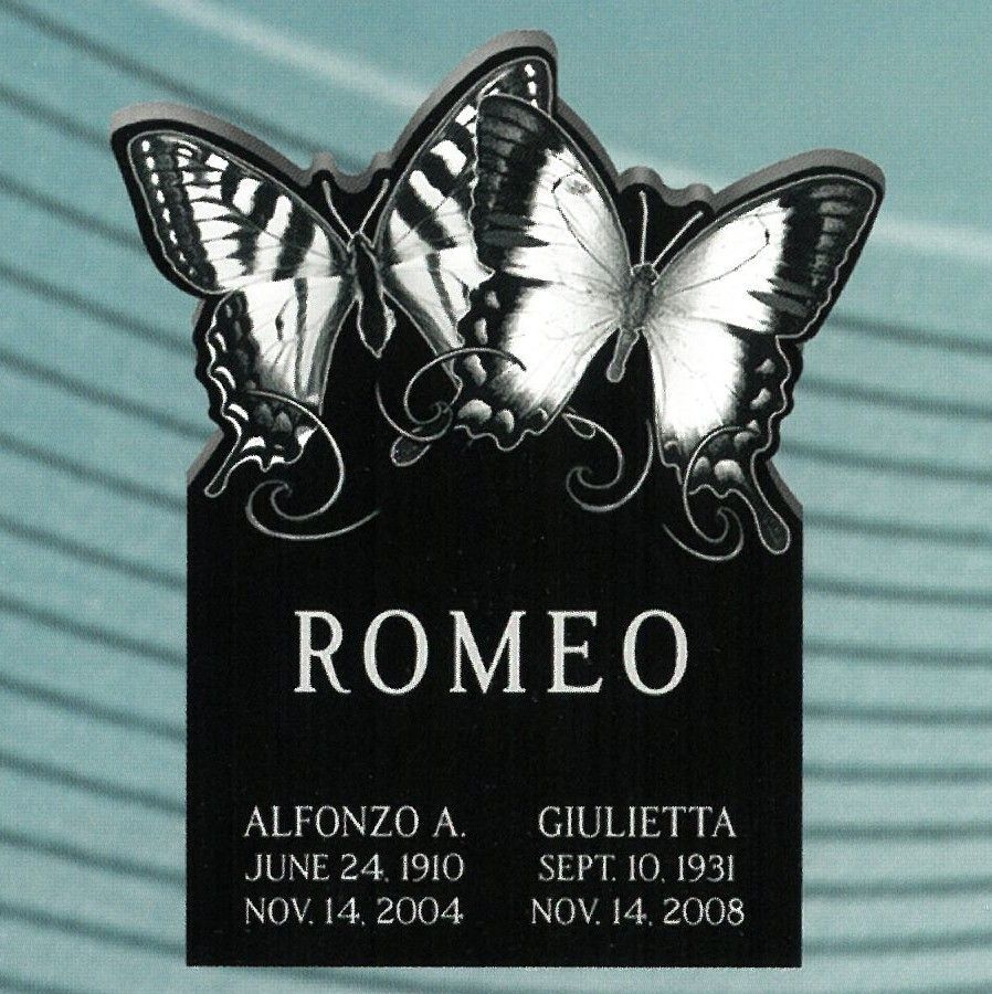 Black memorial plaque with three butterflies and the name “ROMEO,” with dates for Alfonzo A. and Giulietta.