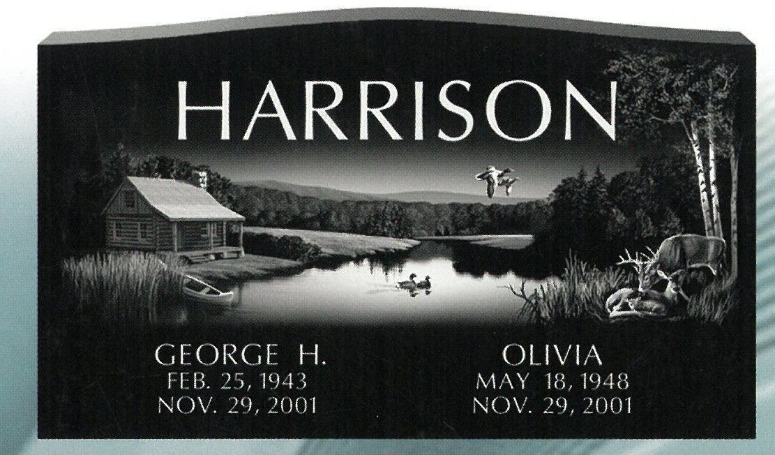 Black Harrison gravestone with lake scene and names George H. and Olivia, with dates etched below