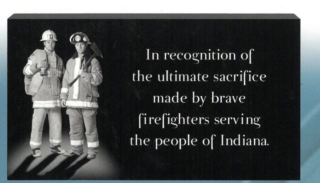 Plaque with two firefighters and inscription honoring brave firefighters serving Indiana.