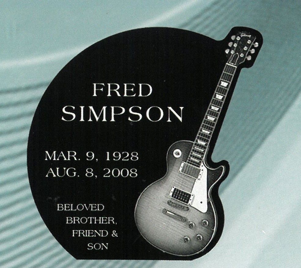 Fred Simpson memorial plaque with dates and a guitar on a teal background