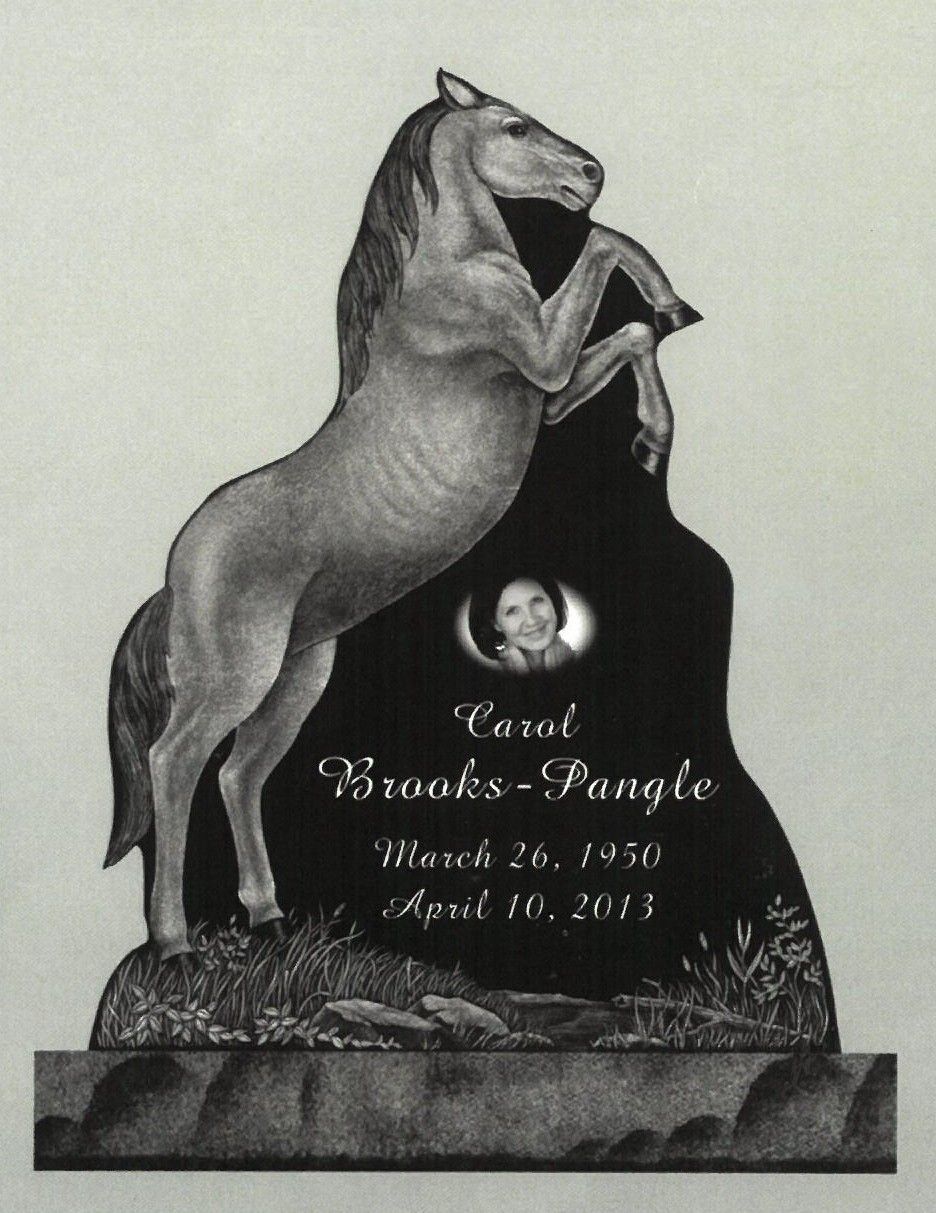 Bronze horse rearing on a plaque with engraved text and a small medallion