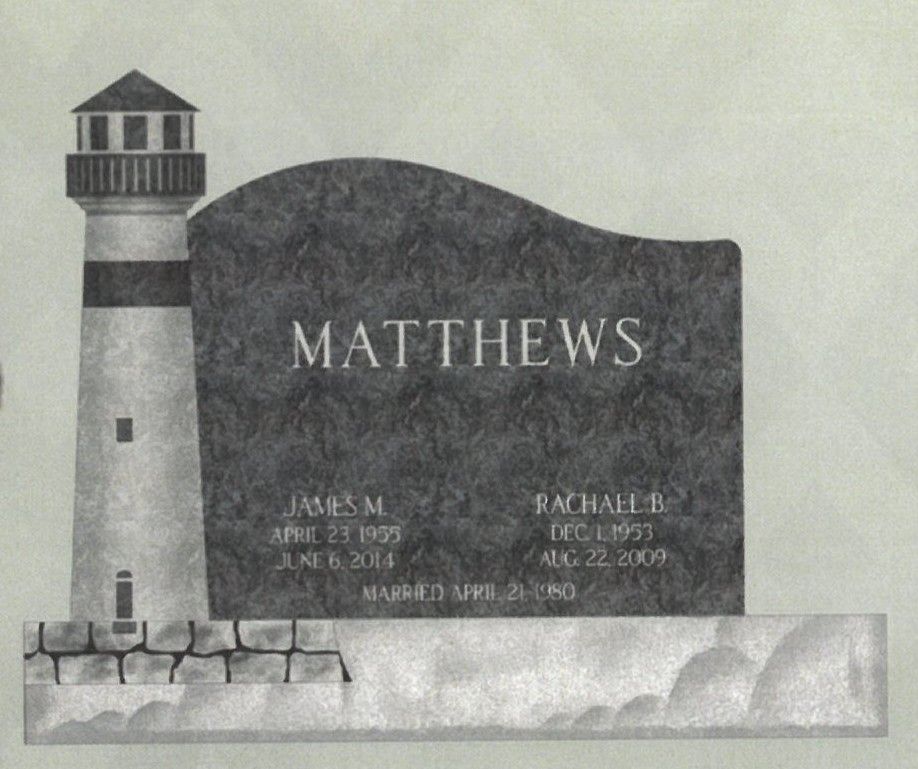 Gray memorial plaque with lighthouse and the name MATTHEWS engraved above smaller names and dates