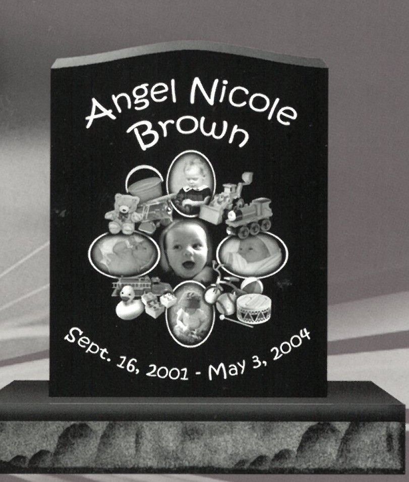 Black memorial plaque with the name Angel Nicole Brown and dates Sept. 26, 2002–May 3, 2004.