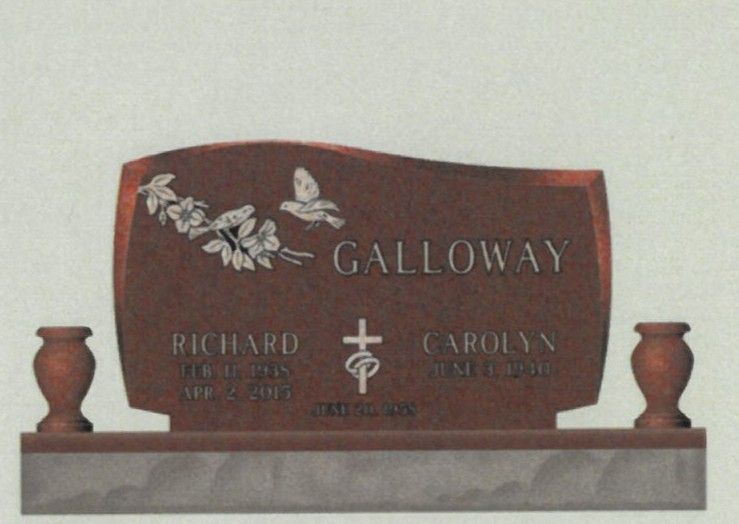 Granite memorial headstone with engraved flowers, dove, and the name Galloway on a gray base