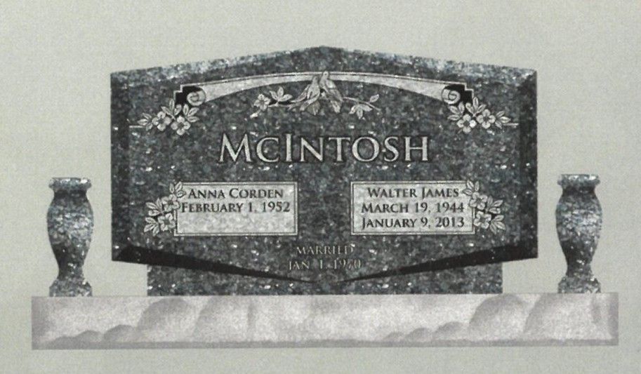 Black granite McIntosh memorial headstone with engraved names and dates, flanked by two vases.