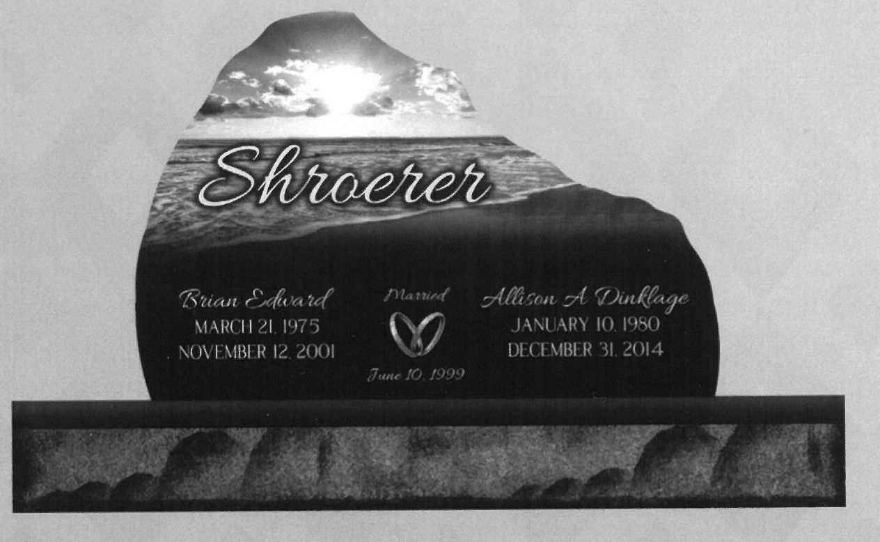 Black memorial headstone with the name 