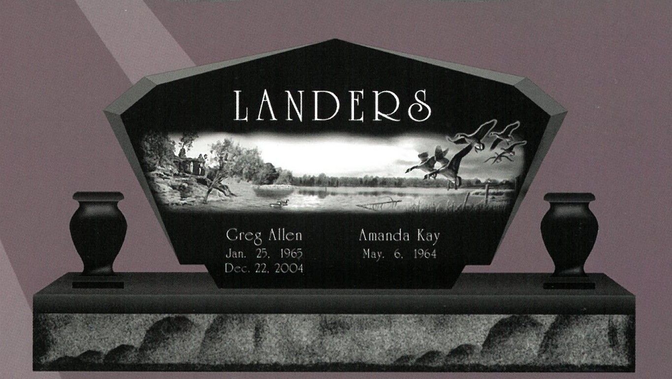 Black granite gravestone with vase holders, engraved “LANDERS,” in a cemetery.
