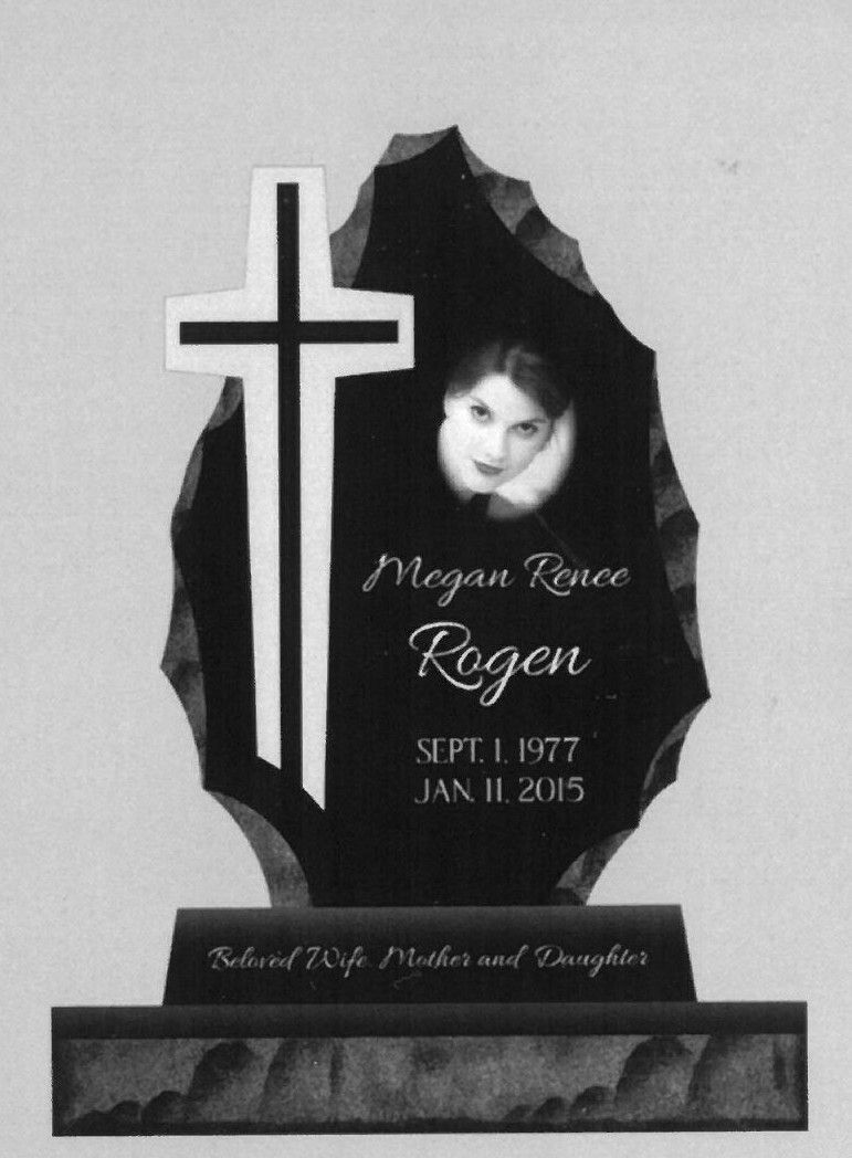 Black memorial tombstone with cross and a portrait photo, engraved with dates and a name