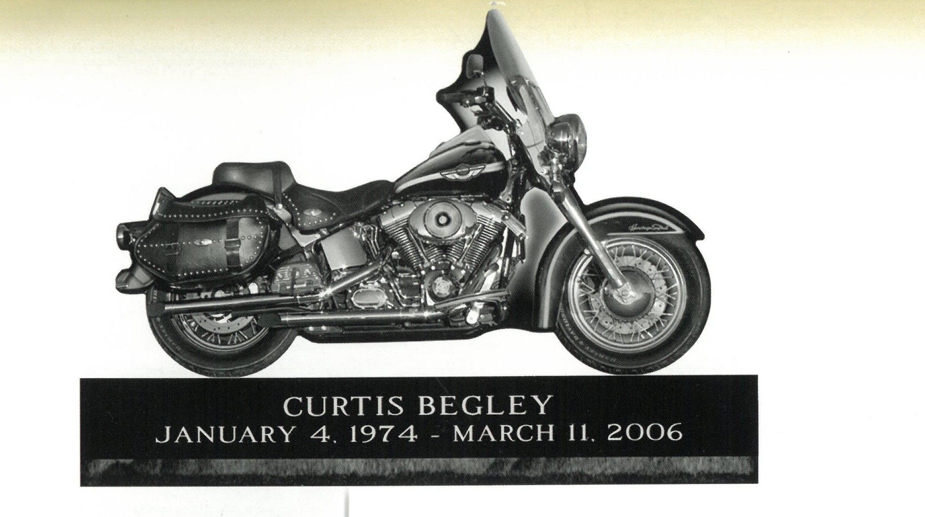 Motorcycle memorial plaque for Curtis Begley, with dates January 4, 1974–March 11, 2006.