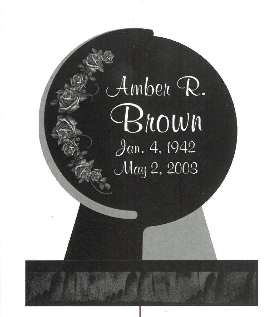 Black memorial headstone with floral engraving and the name Amber R. Brown, Jan. 4, 1942–May 2, 2003