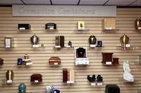 Variety of shoes and bags displayed on wall-mounted shelves in a retail store.