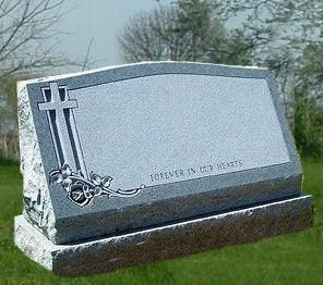 Gray gravestone with a cross and chain detail in a grassy cemetery, engraved “Forever in our hearts”
