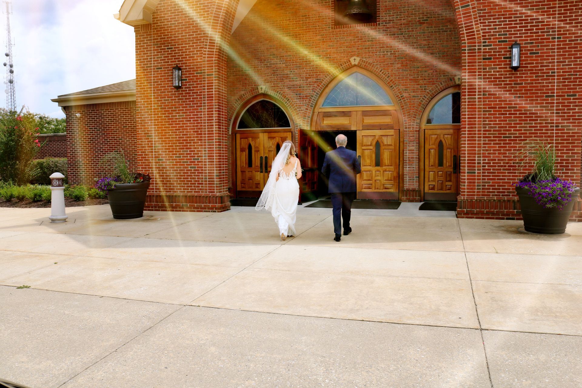 A bride and groom are walking out of a church. Eastern Shore Transportation LLC. 145 West Ostend St. Baltimore, Maryland 21230 1-800-689-6849