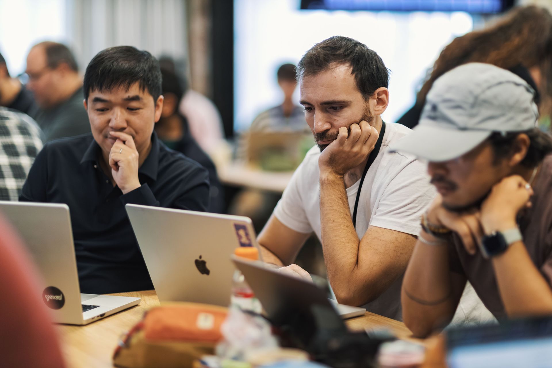 Software team working together on laptops