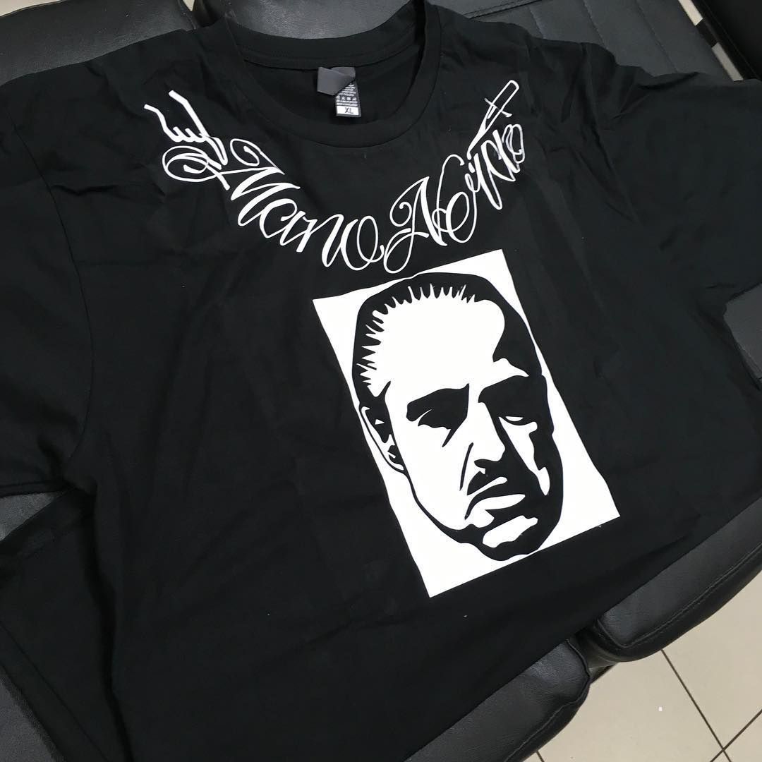 A Black T-Shirt With A Picture Of A Man On It — Cairns Custom T-Shirts In Cairns City, QLD