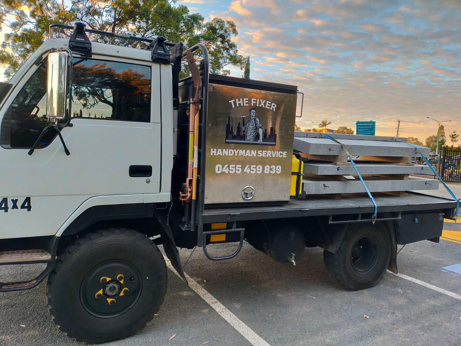 A white truck is parked in a parking lot — Cairns Custom T-Shirts In Cairns City, QLD