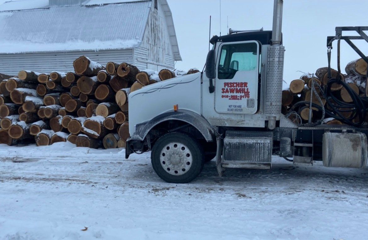 fischer sawmill tractor with logo on door