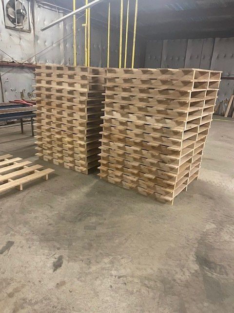 two stacks of pallets with extended top planks