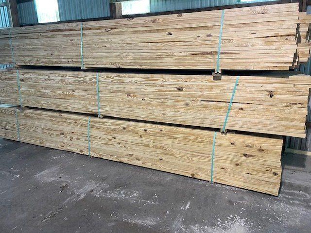 grade lumber boards stacked and banded together