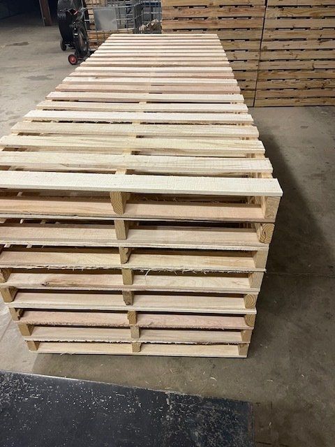 front view of stacked long pallets