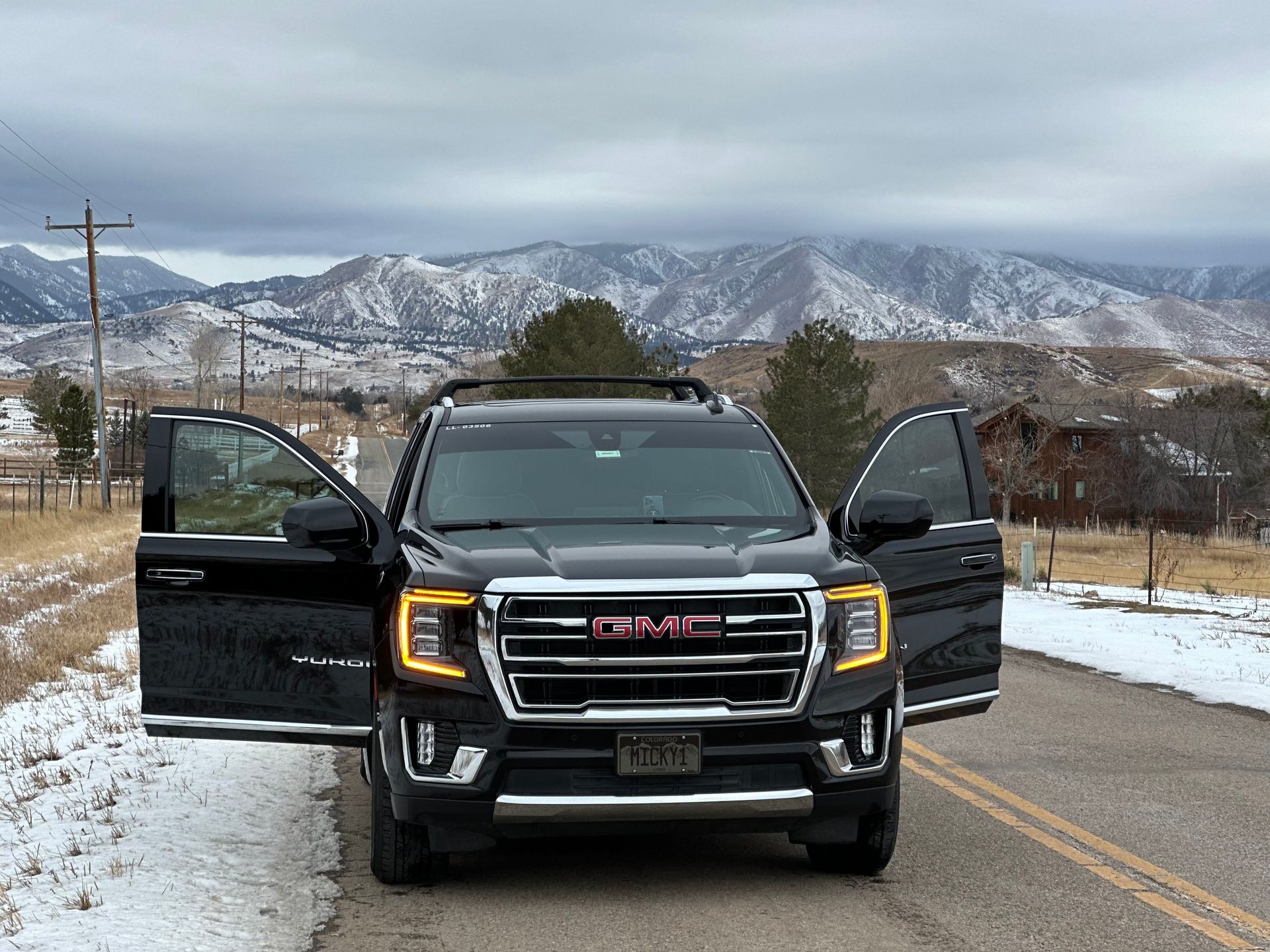 Black SUV beside a private jet for private aviation ground transportation in Denver
