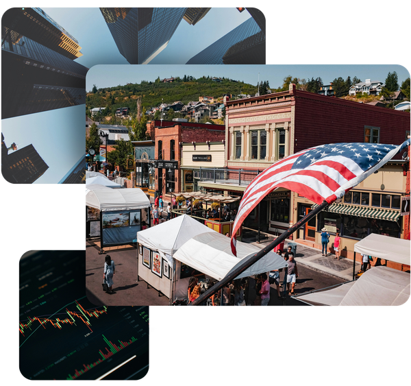 Downtown street scene with an American flag, market stalls, and buildings.