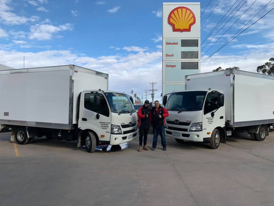 Two white trucks and a two-man | Mildura, VIC | Benetook Automotive & Bus Hire Two white trucks and a two-man | Mildura, VIC | Benetook Automotive & Bus Hire