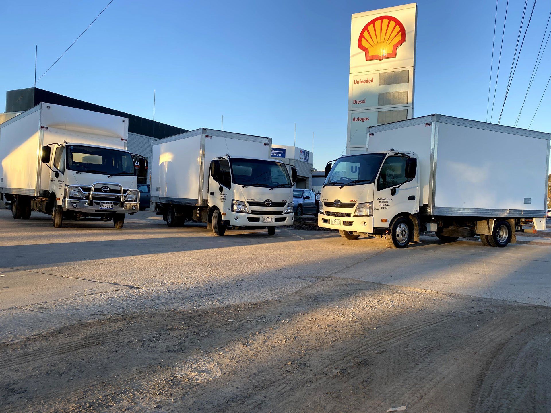 Three white trucks parking | Mildura, VIC | Benetook Automotive & Bus Hire Three white trucks parking | Mildura, VIC | Benetook Automotive & Bus Hire