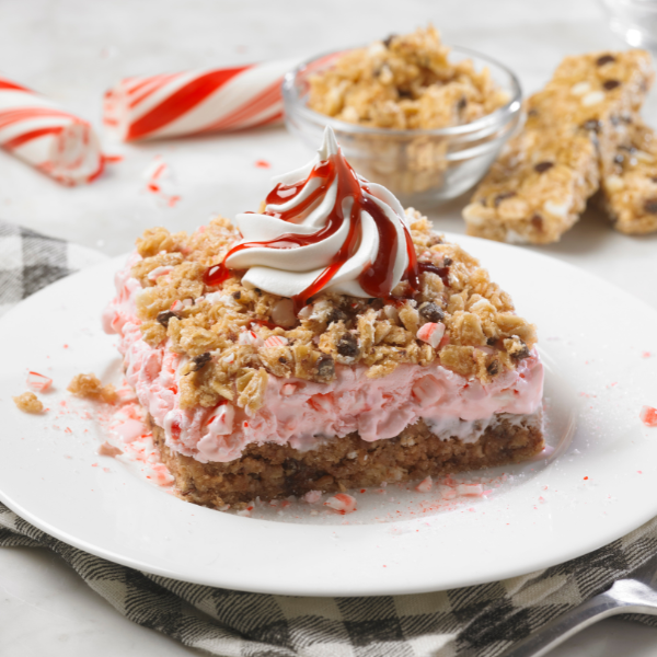 peppermint ice cream cake with granola topping and peppermint and chocolate pieces