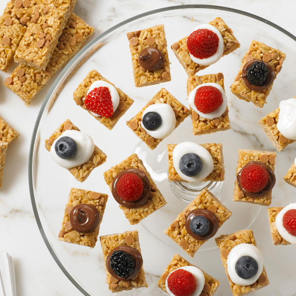 granola bar halves topped with yogurt and fresh fruit