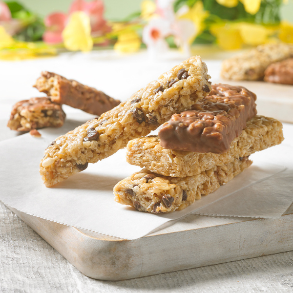 image of stacked chewy granola bars on a white background