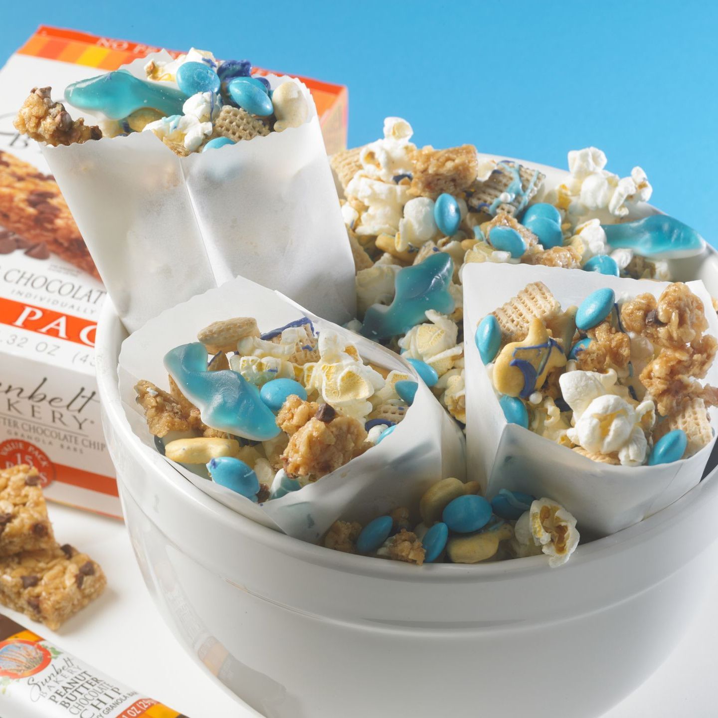 snack mix with shark gummy candy, granola bars and popcorn