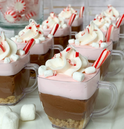 cheesecake cups layered with peppermint-flavored cheesecake, chocolate pudding, whipped cream and marshmallows