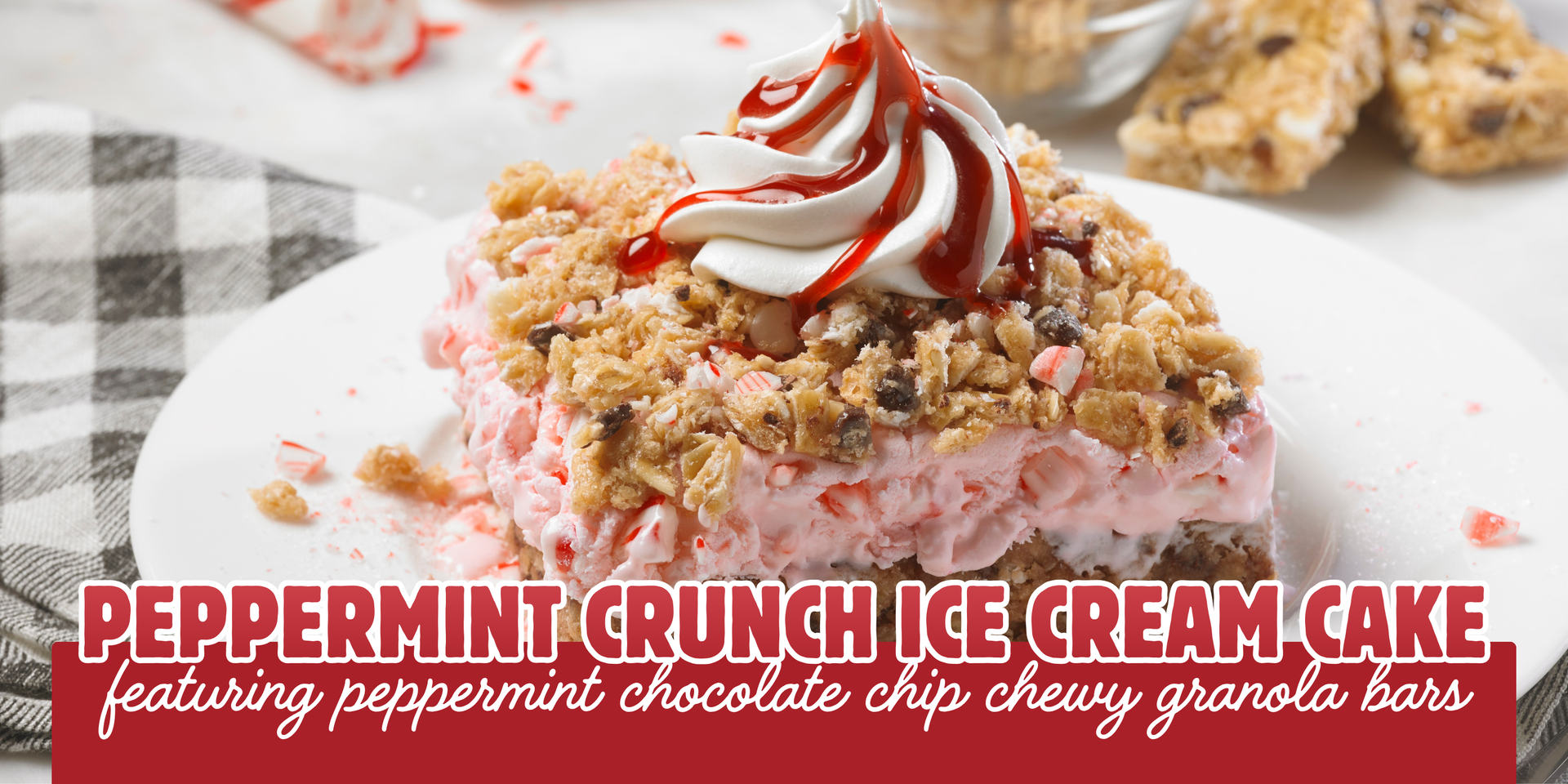 Peppermint crunch ice cream cake slice topped with whipped cream and candy cane swirls on a white plate