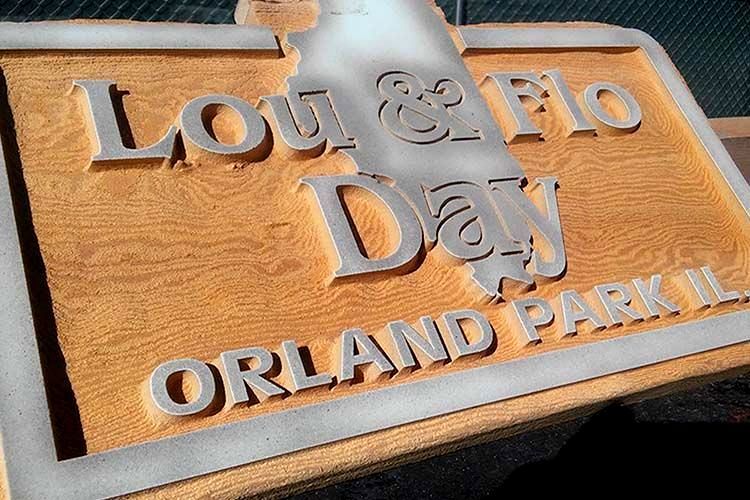 A wooden etched sign from dustless blasting