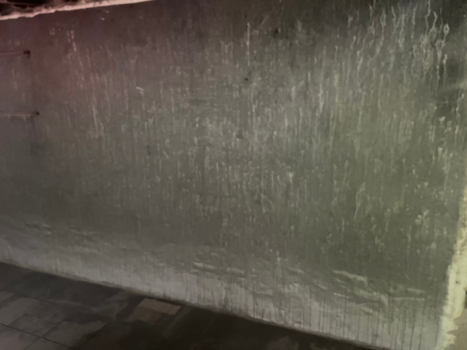A close up of a wall with a lot of stains on it.
