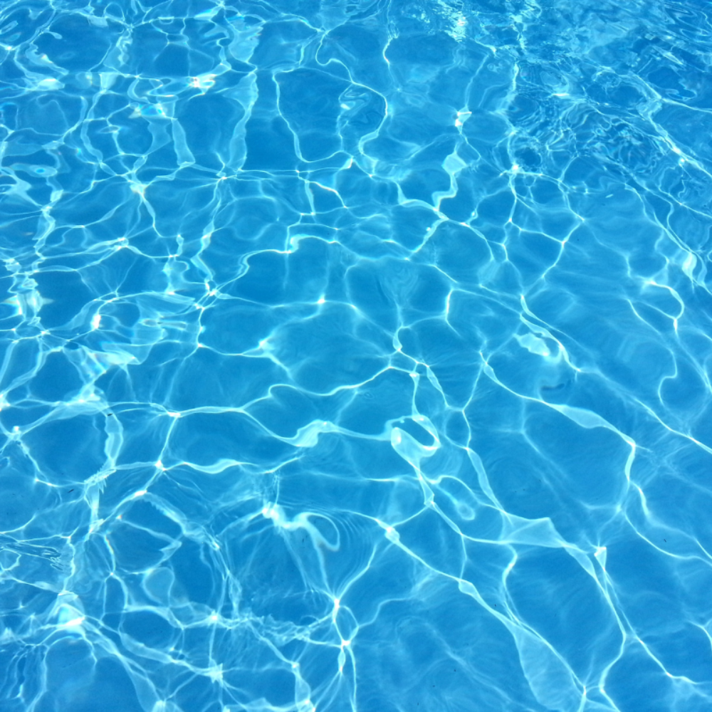 A close up of a swimming pool with blue water