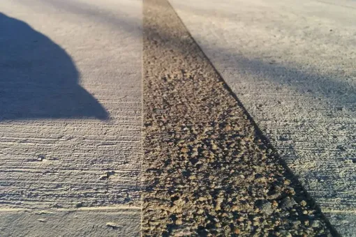 Contact Us A shadow of a person is cast on a concrete surface