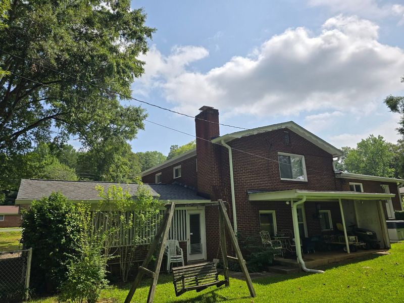 Red brick house with swing