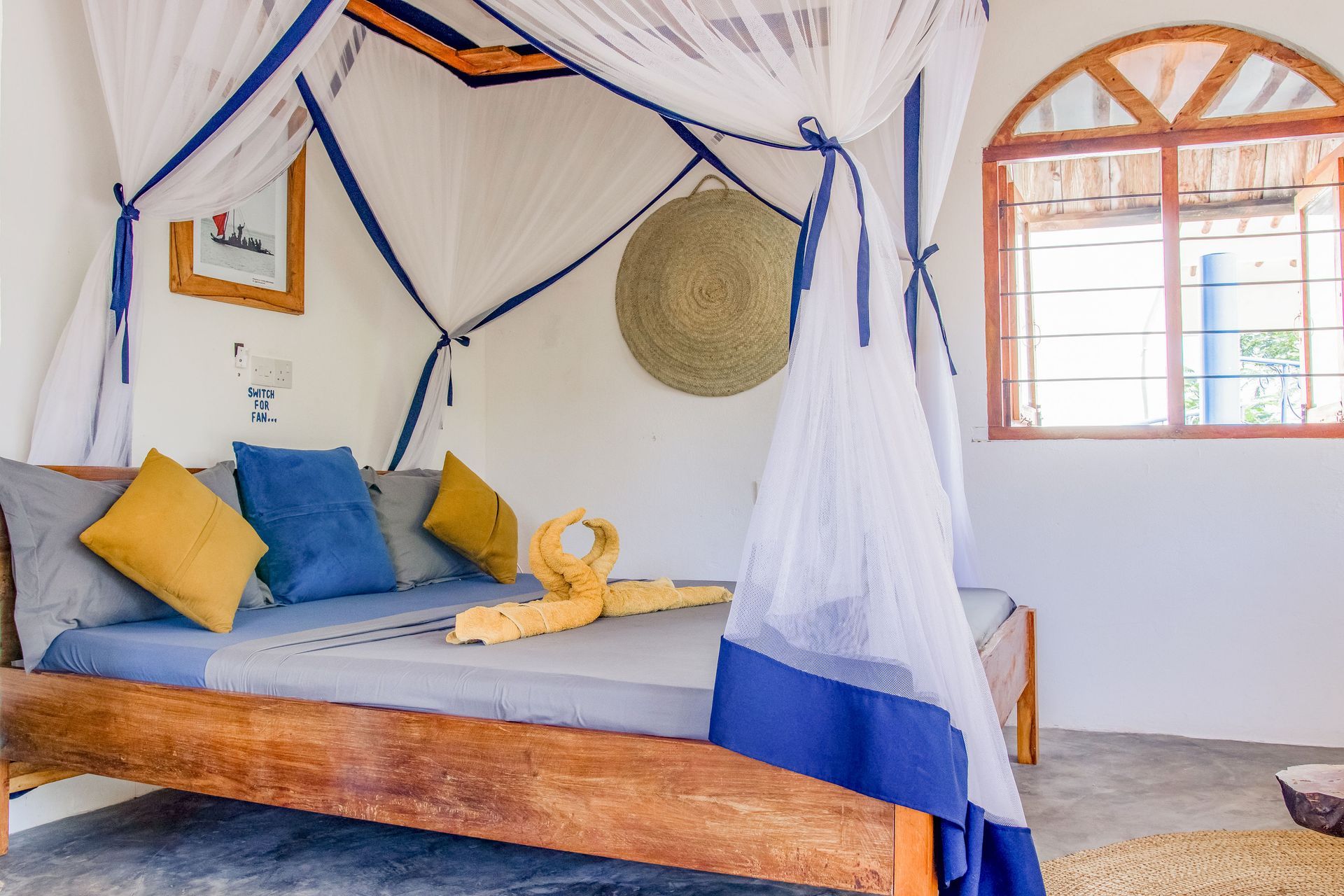 Bedroom for 3 persons, double bed, balcony with tropical garden view, ceiling fan