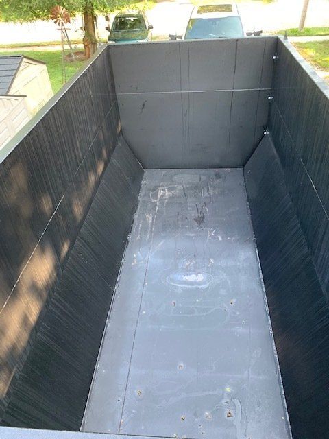 three dumpster beside the road