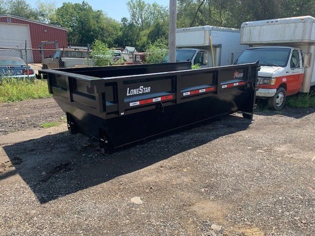 garbage dumpsters with different colors