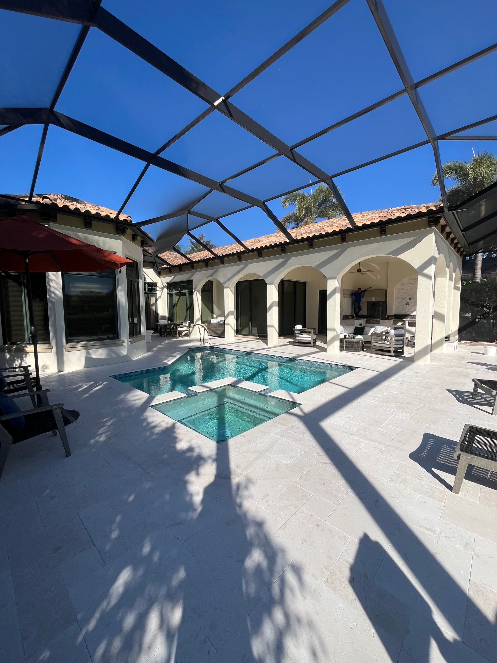 A large house with a swimming pool in the backyard
