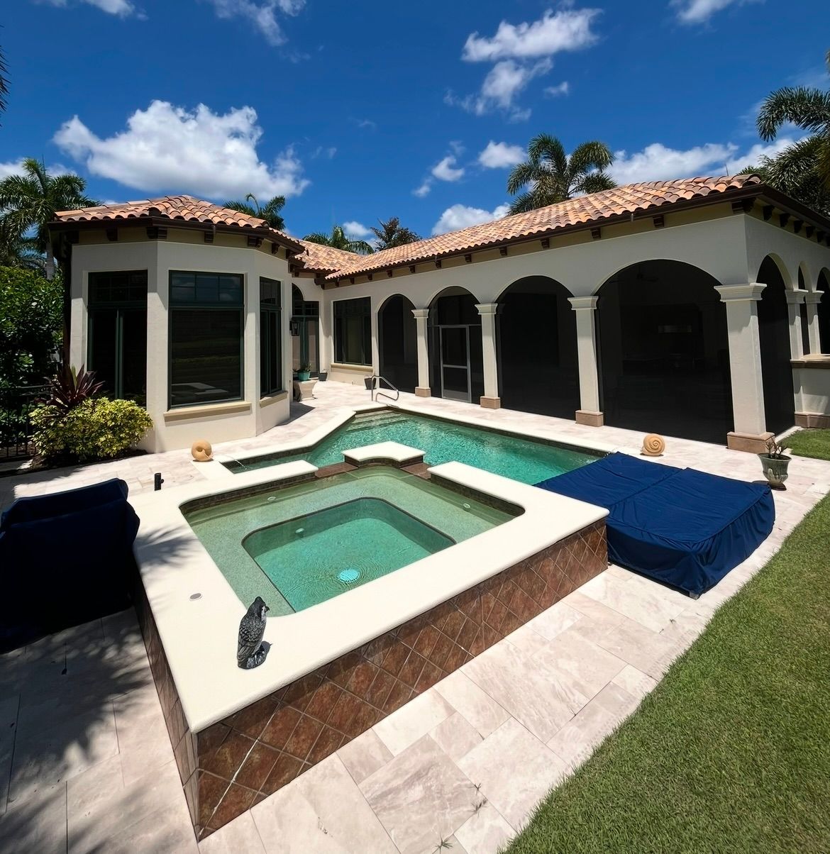 A large house with a swimming pool and a hot tub