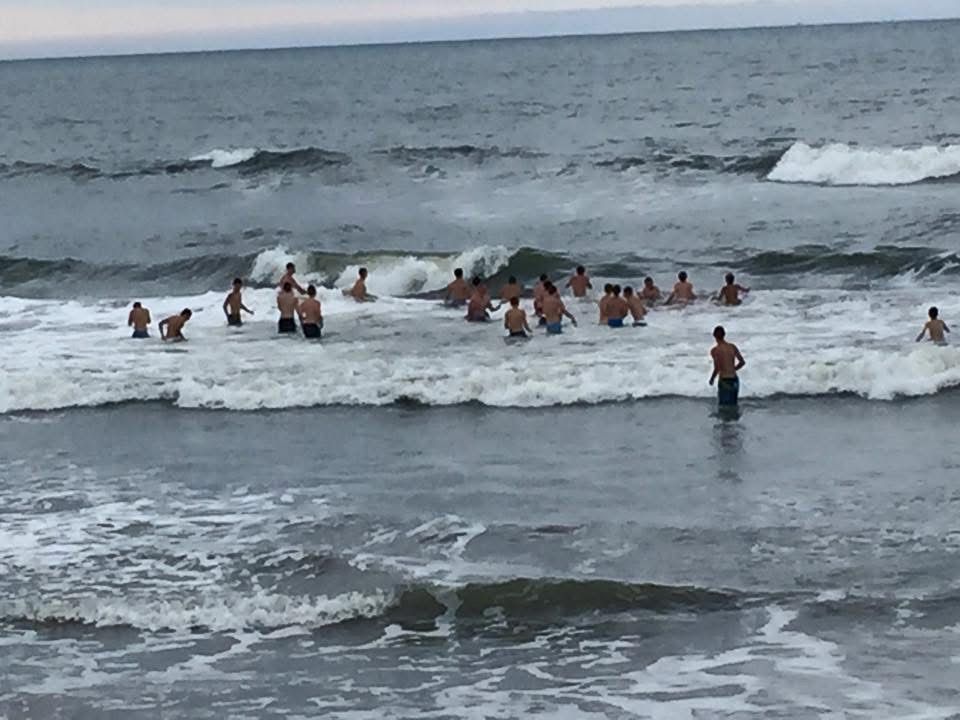 Group of people in the ocean waves.