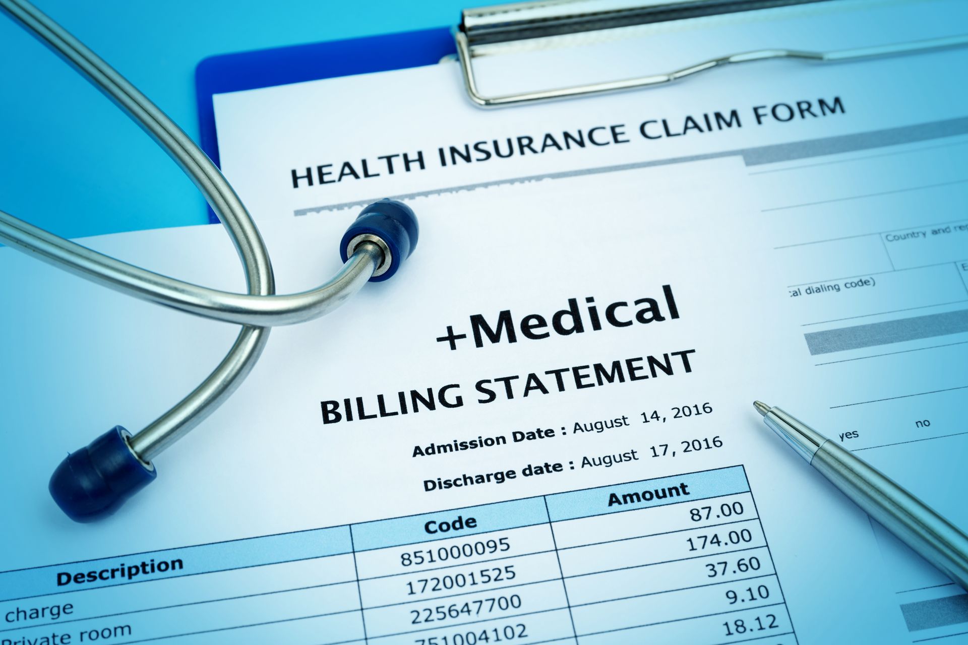 Medical billing statement and health insurance claim form with a stethoscope and pen. Medical billing statement and health insurance claim form with a stethoscope and pen.